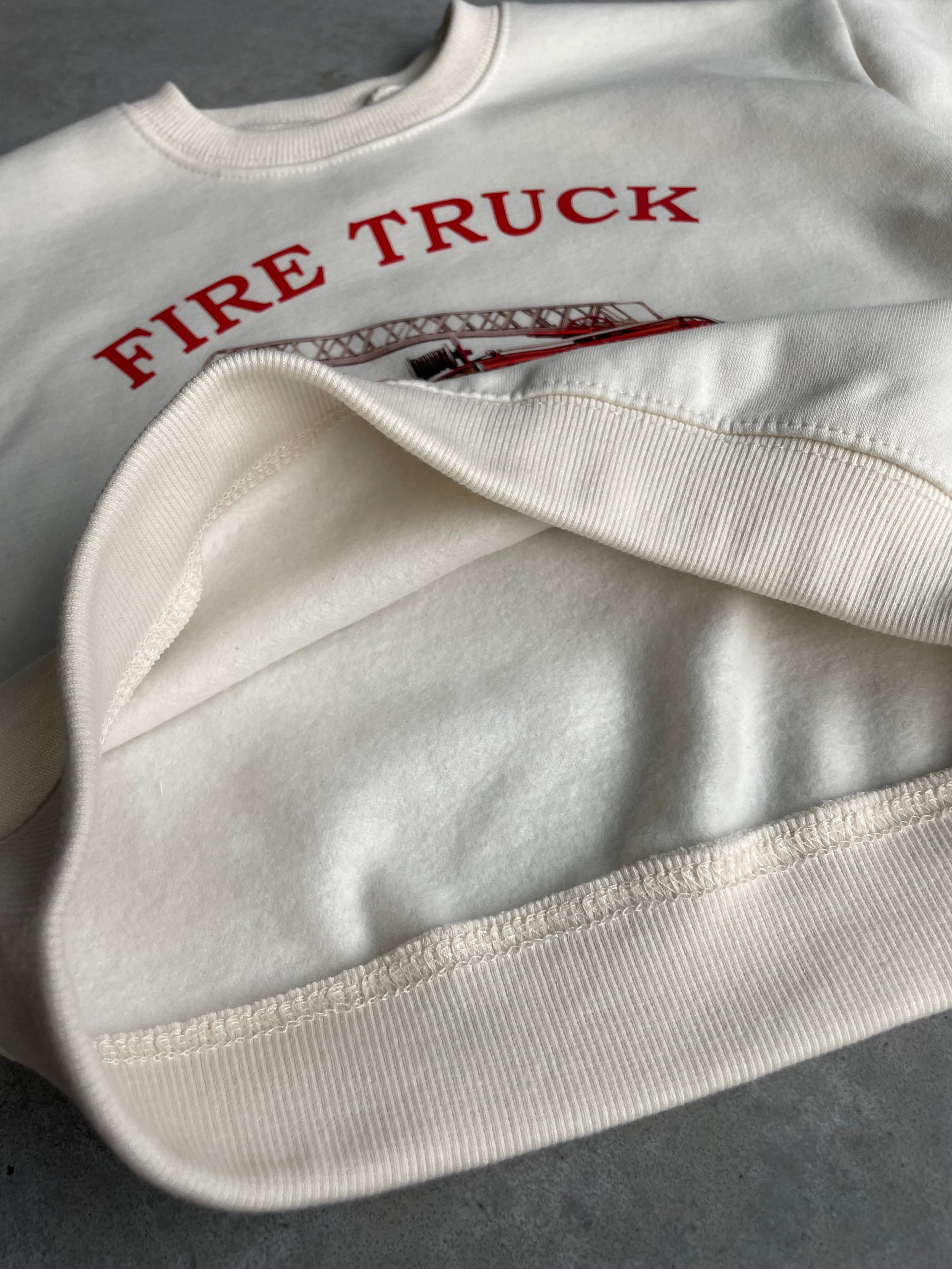 Oversized fire truck sweater
