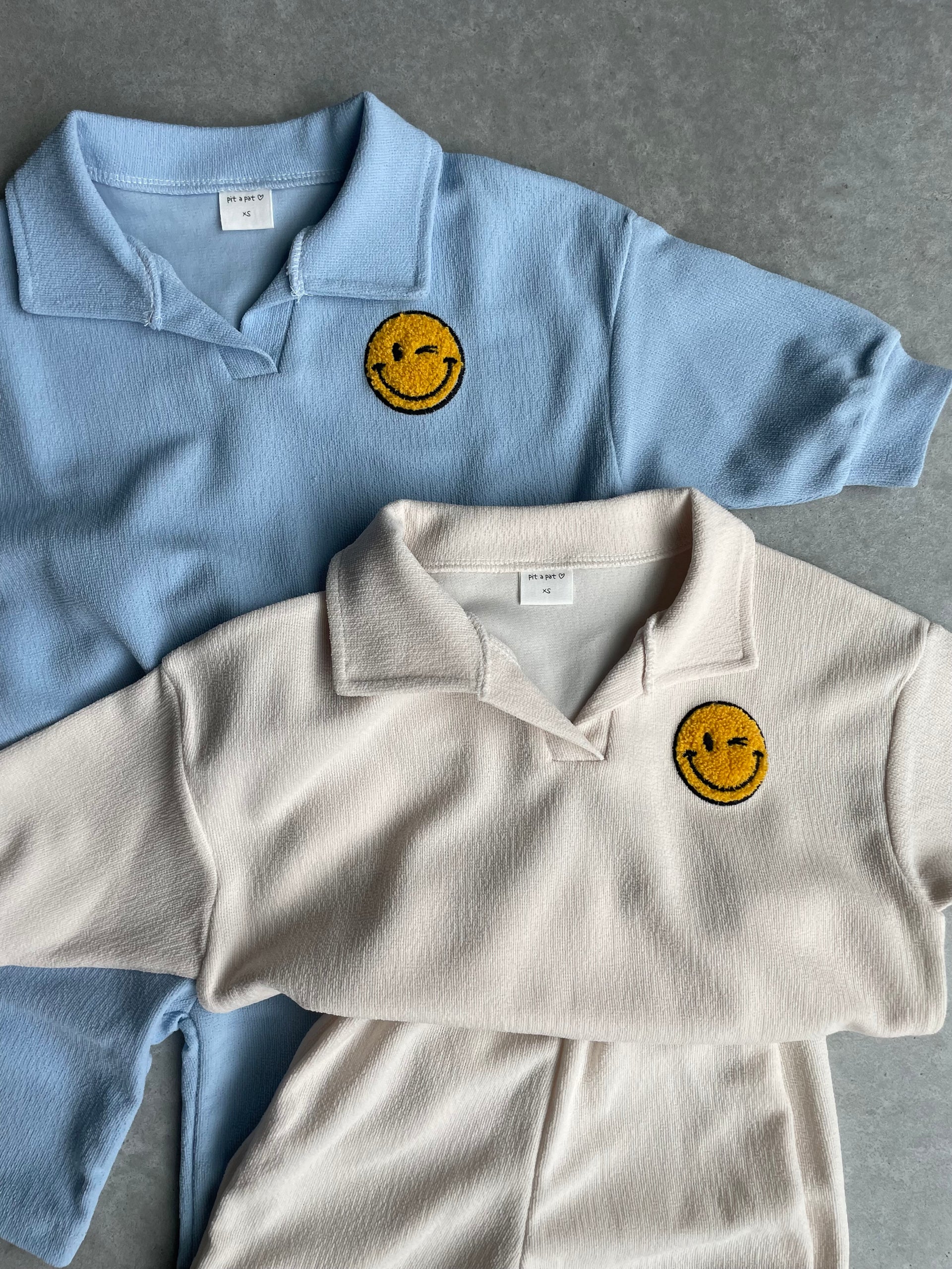 Col setje met geborduurde smiley