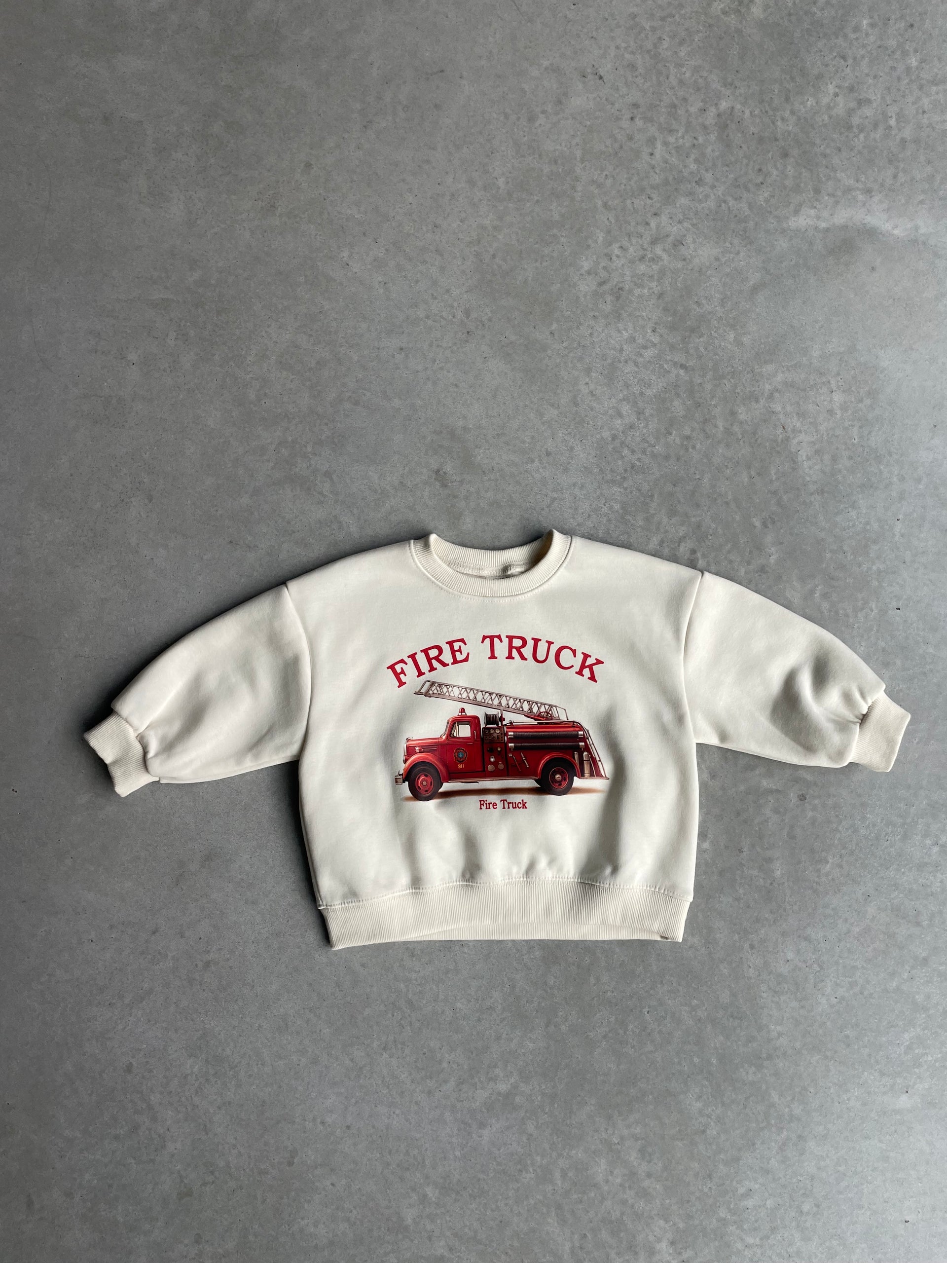 Oversized fire truck sweater